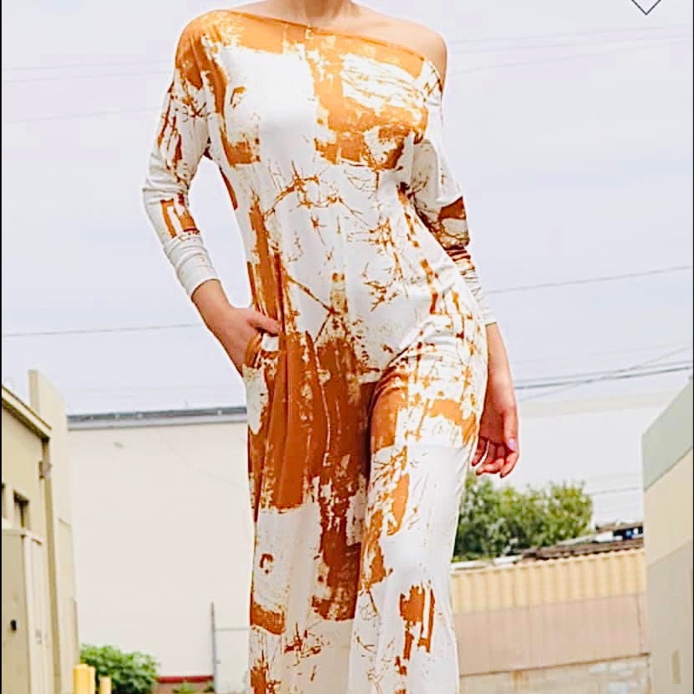 Off the shoulder , relax fit long sleeve jumpsuit with side pockets. Casual,